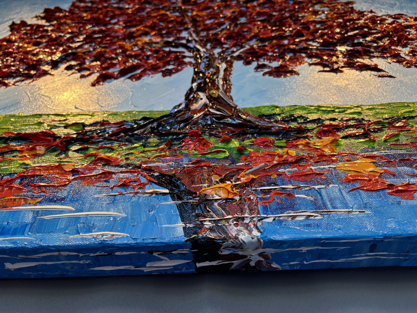 Abstract painting of a tree with colorful brushstrokes on a blue background by Isabelle Dupuy