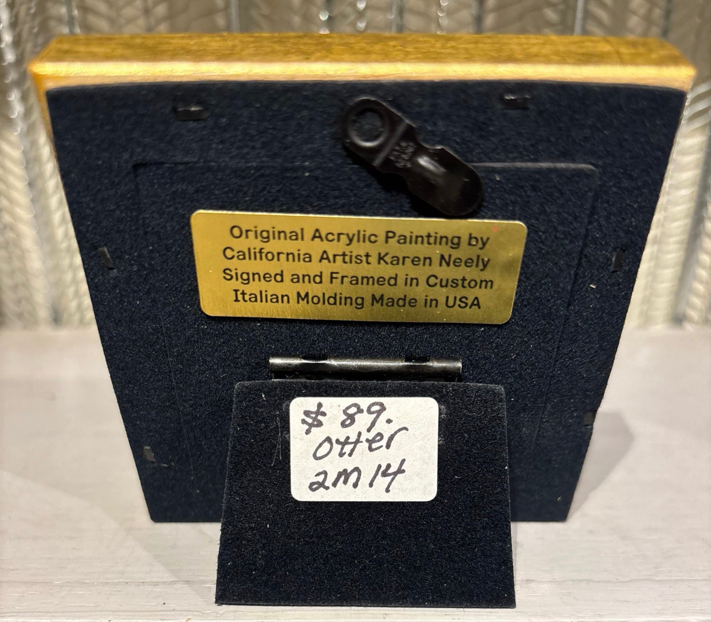 Otter miniature original acrylic painting by Karen Neely, 2.5x2.5", featuring a sea otter floating in ocean water, framed in gold Italian moulding (3.5x3.5" framed).