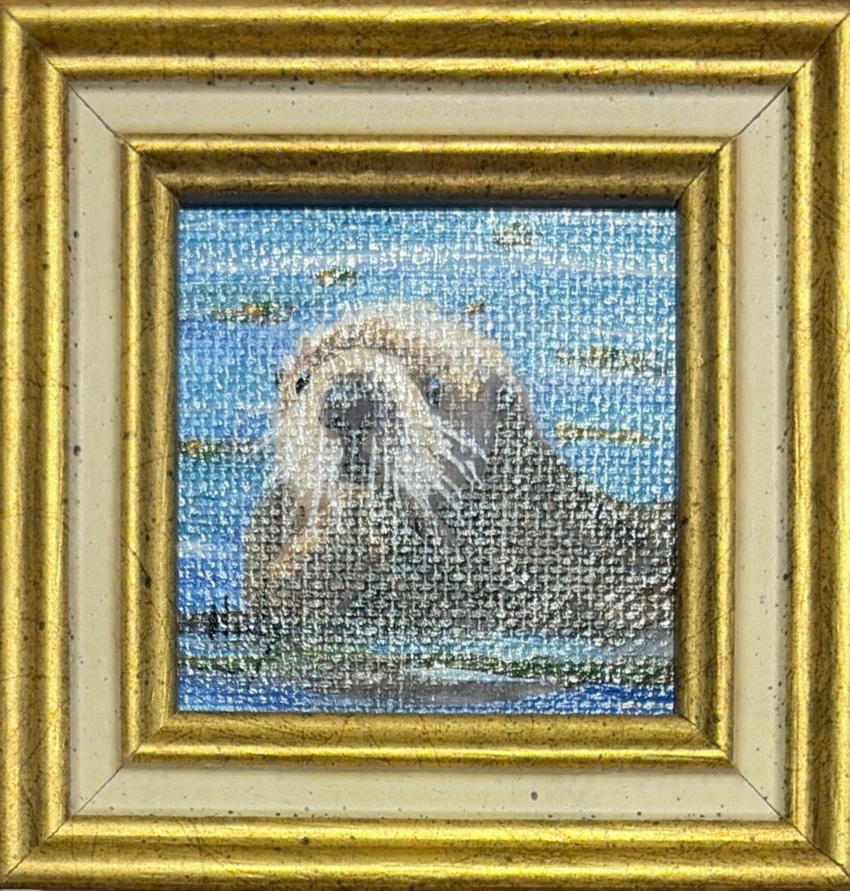 Otter original acrylic painting by Karen Neely featuring a curious sea otter floating on calm blue water, custom framed in an Italian gold moulding.