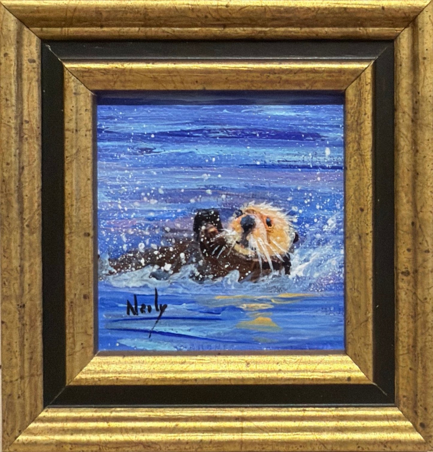 Otter original acrylic painting by Karen Neely featuring a playful sea otter splashing through vibrant blue water, custom framed in an Italian gold moulding.