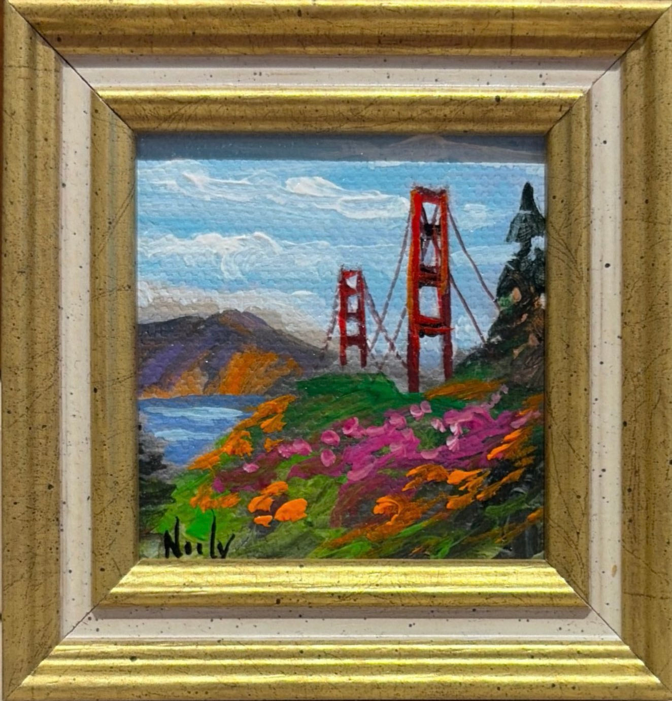 Golden Gate Bridge original acrylic painting by Karen Neely featuring the iconic San Francisco bridge surrounded by colorful spring wildflowers, custom framed in an Italian gold moulding.
