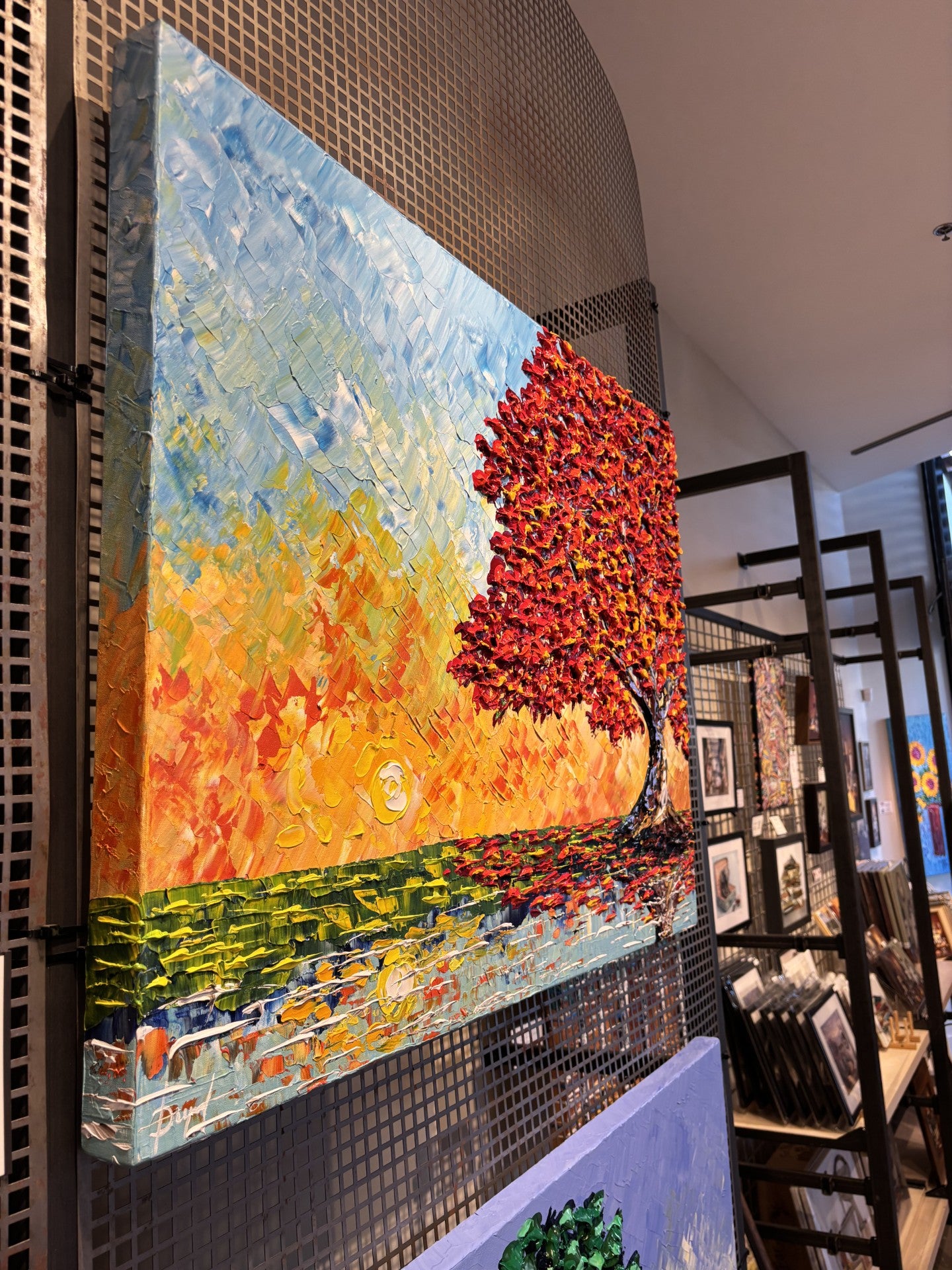 Colorful abstract painting of a fall colored tree by Isabelle Dupuy available at Gallery 1870
