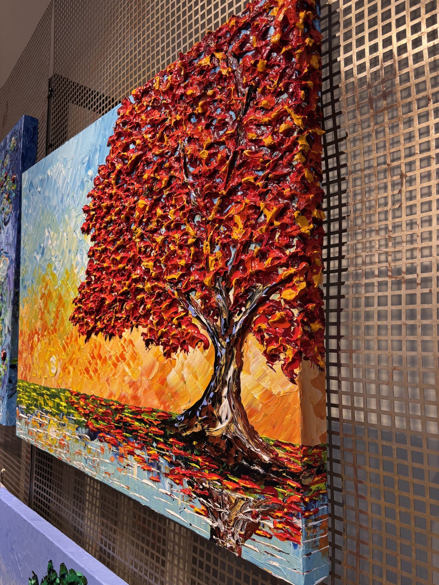 Colorful abstract painting of a tree with red leaves painted with lots of texture or heavy impasto by Isabelle Dupuy available at Gallery 1870.