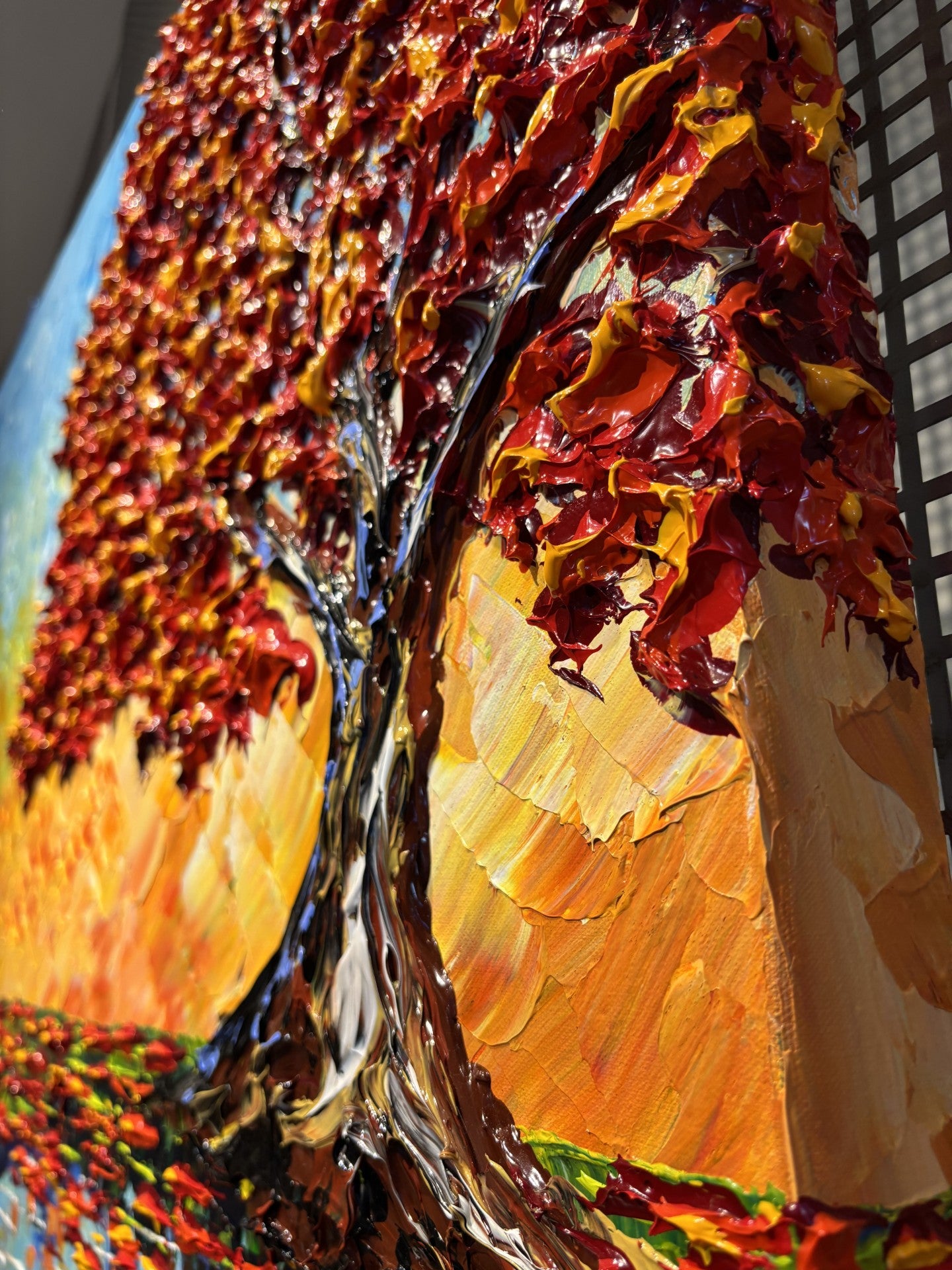 Colorful abstract painting of a tree with autumn foliage close up.