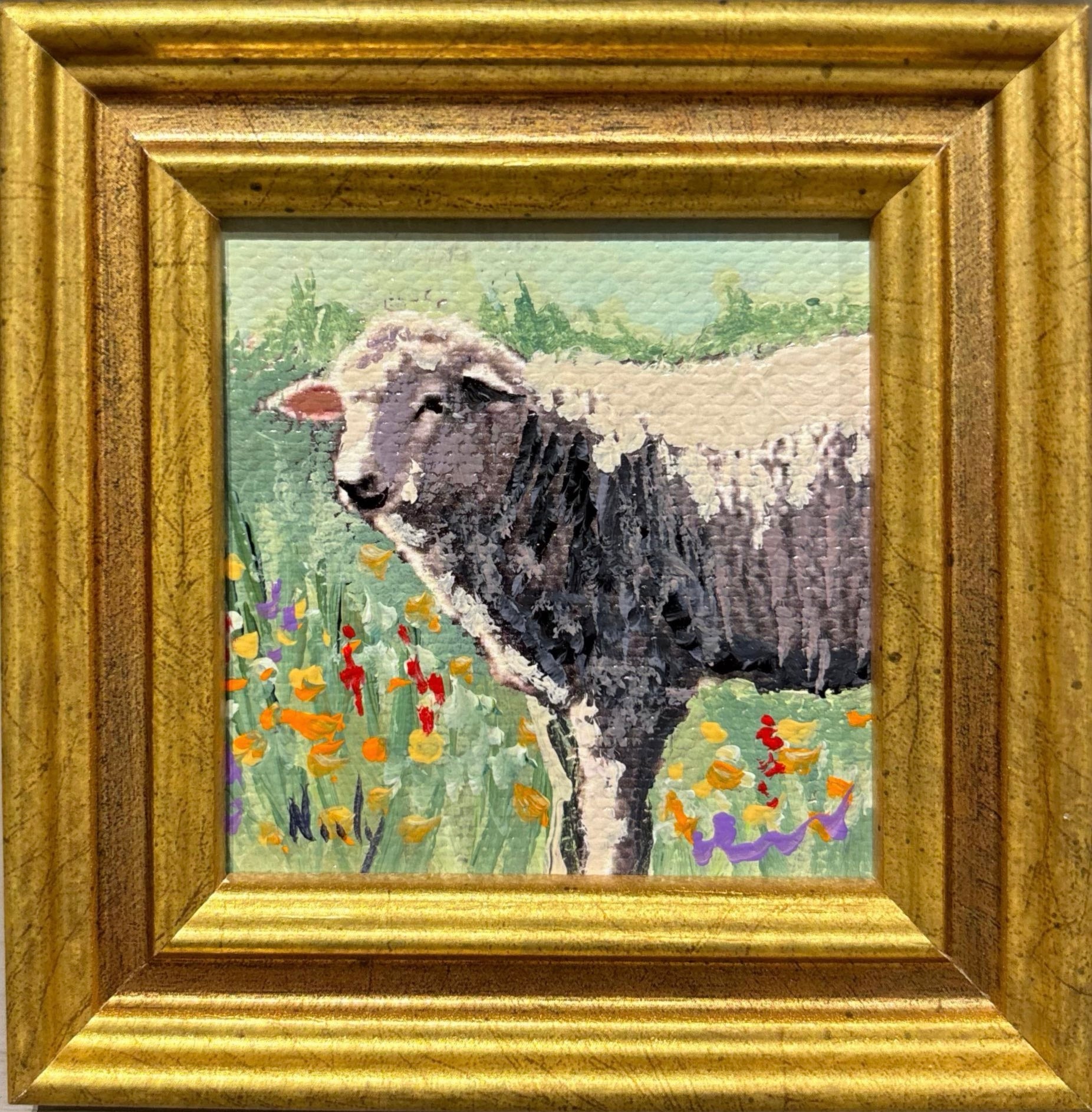 Sheep miniature original acrylic painting by Karen Neely featuring a sheep standing in a colorful wildflower meadow, framed in gold Italian moulding.