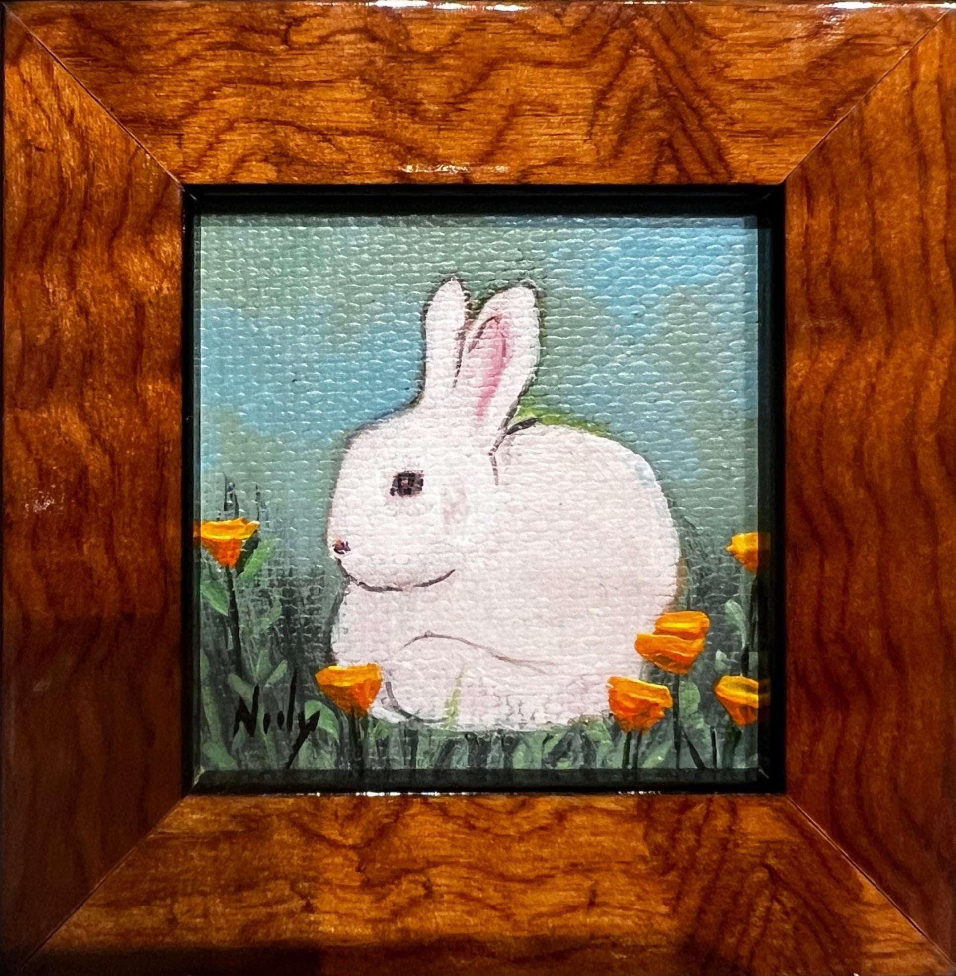 Bunny miniature painting by Karen Neely hanging on wine bottle