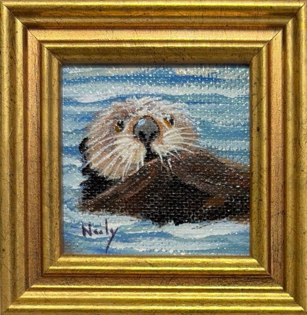 Karen Neely original miniature acrylic painting titled Otter featuring a sea otter floating in blue ocean water, framed in custom Italian moulding.