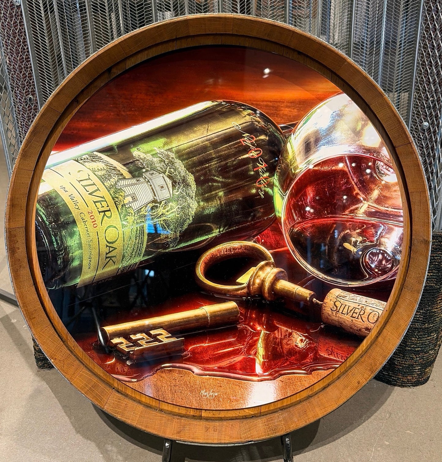Mars Lasar Silver Oak Times barrel top artwork featuring a Silver Oak Cabernet Sauvignon bottle, wine glass, vintage key, and cork displayed on an authentic wine barrel top.