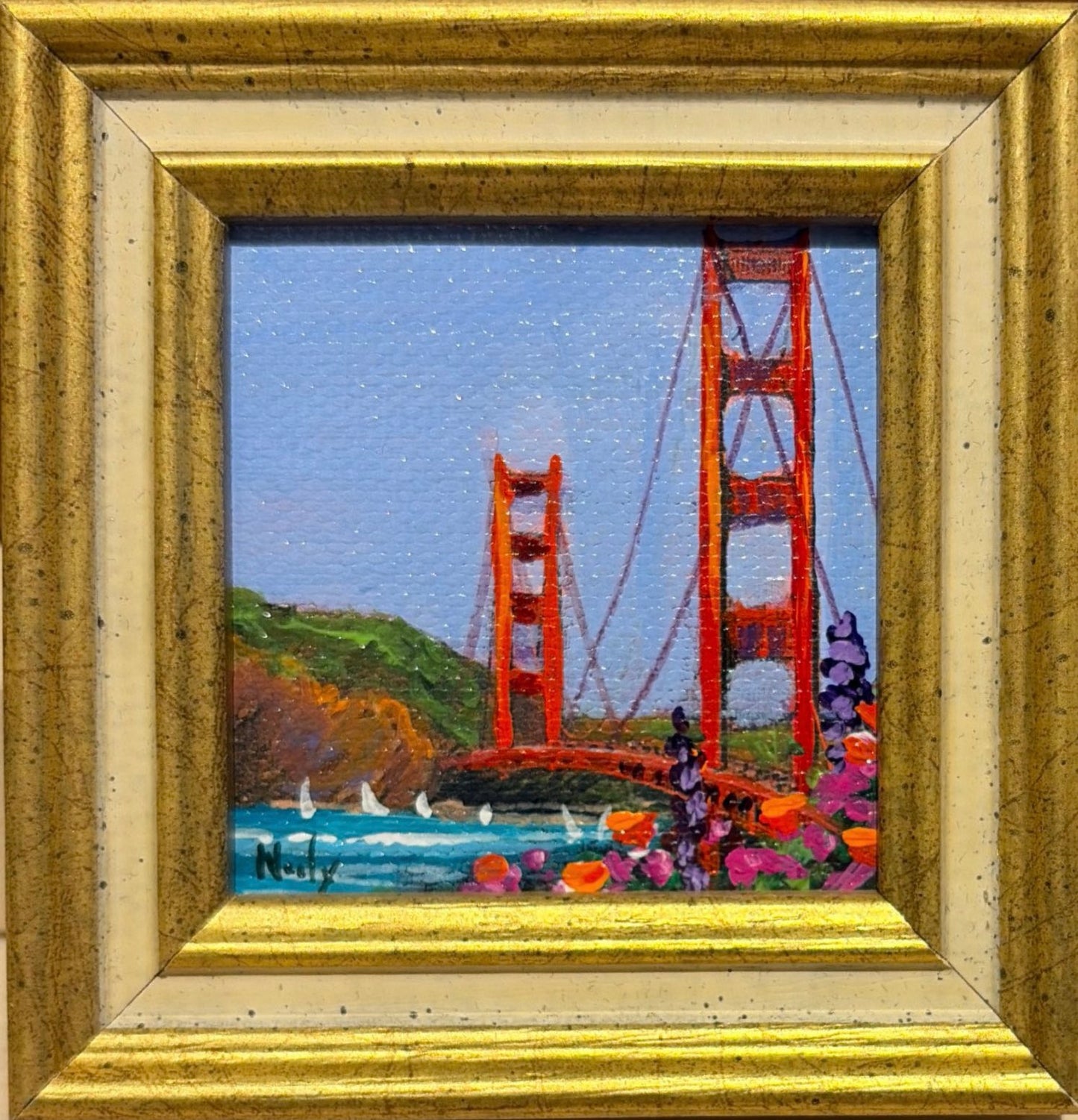 Golden Gate Bridge original acrylic painting by Karen Neely featuring the iconic San Francisco bridge with colorful wildflowers, custom framed in an Italian gold moulding.