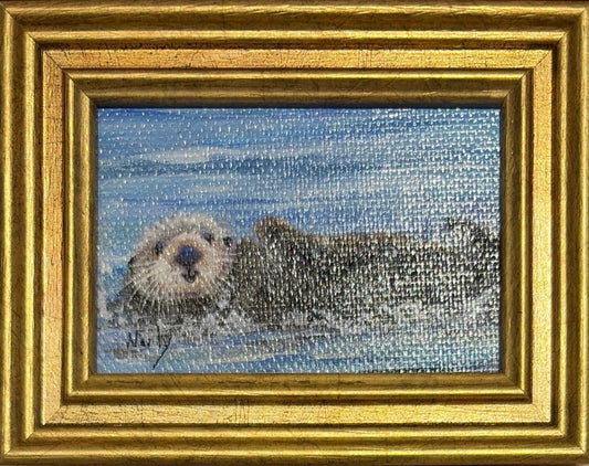 Otter original acrylic painting by Karen Neely featuring a peaceful sea otter floating on calm blue water, custom framed in an Italian gold moulding.