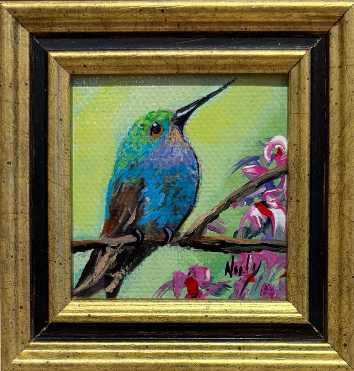 Hummingbird original acrylic painting by Karen Neely featuring a vibrant blue-green hummingbird perched on a flowering branch, custom framed in an Italian gold moulding.