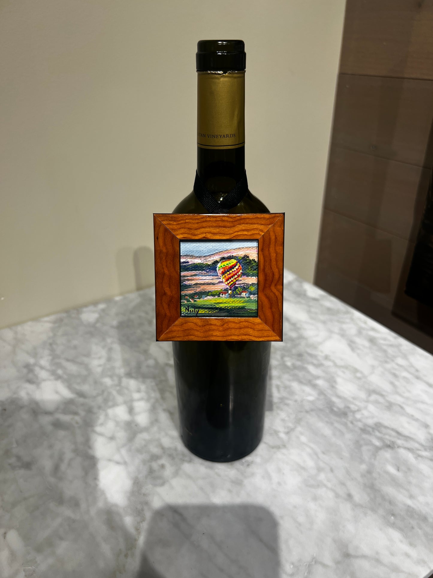 Hot air balloon miniature painting by Karen Neely on wine bottle