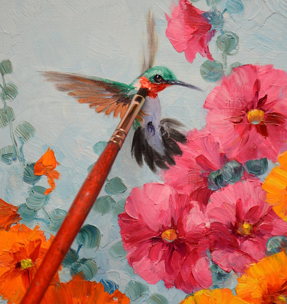Hummin’ in the Hollies 10x10" original oil painting by Mikki Senkarik featuring two hummingbirds among vibrant pink, orange, and red hollyhock flowers. Ready to hang or frame.