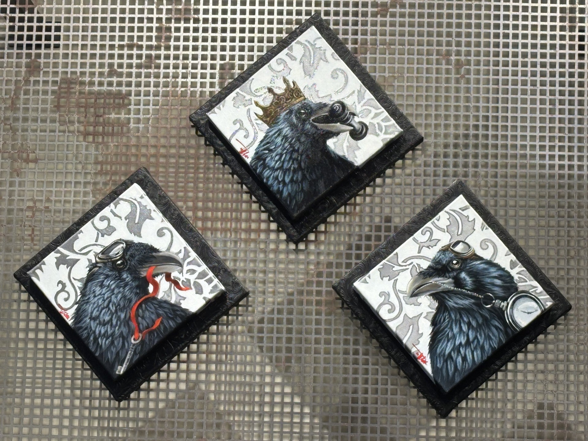 “Triefecta” by Pete Tillack featuring three raven paintings—Checkmate, Key to Success, and On Time.
