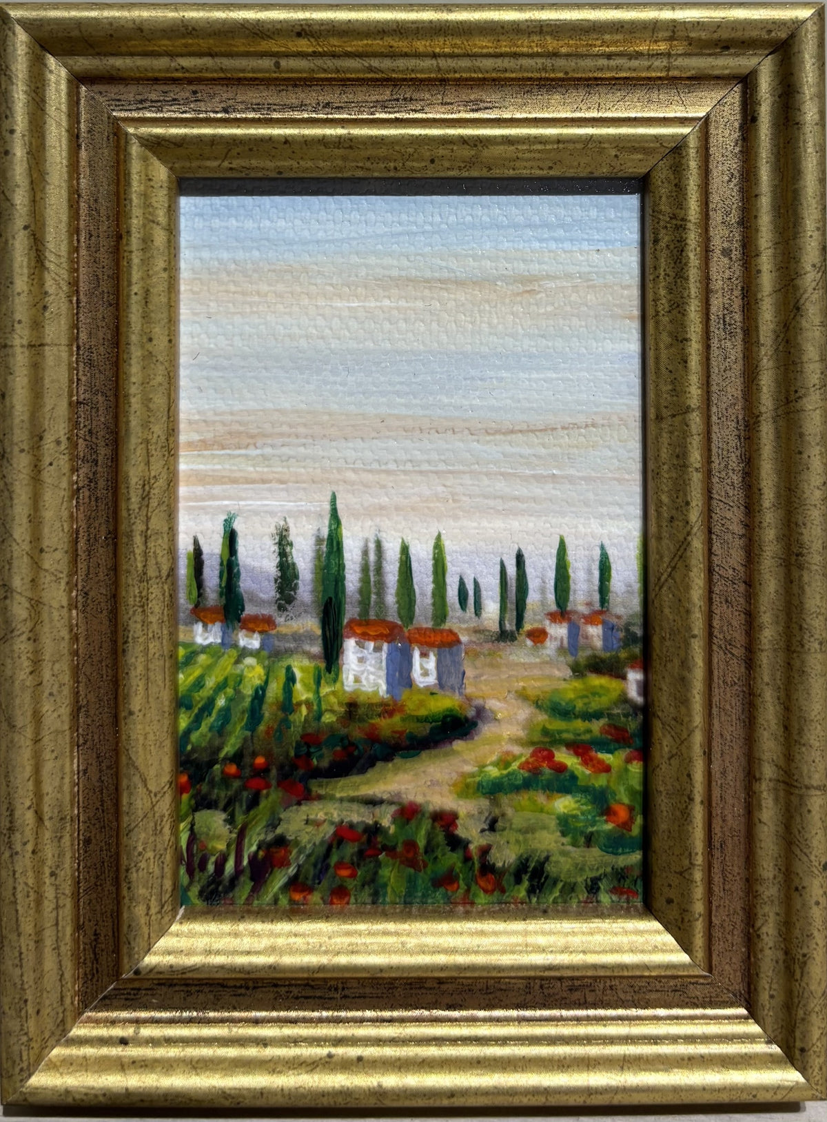 Tuscany miniature original acrylic painting by Karen Neely (#B472), 3x2", featuring Tuscan villas, vineyards, cypress trees, and wildflowers, framed in gold Italian moulding with easel back.